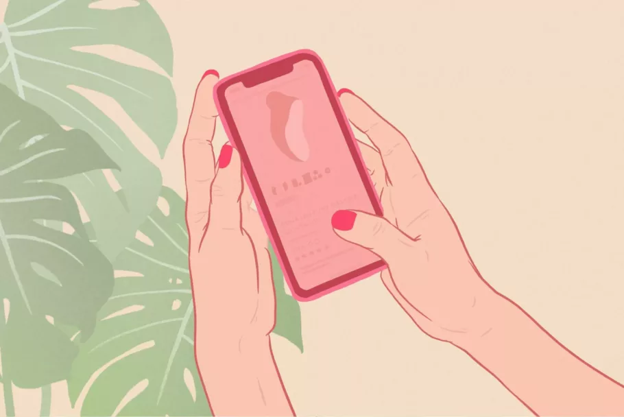 Na tle liści monstery dłonie z czerwonymi paznokciami trzymają smartfon z otwartą stroną sklepu z masażerem LELO Sona.